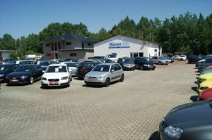 Tomm Automobile Logo