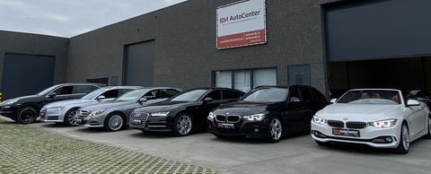 EM AutoCenter CommV Logo