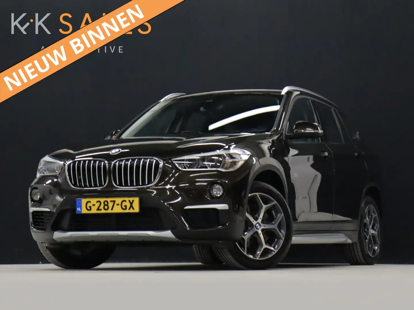 BMW X1 xDrive20i High Executive [AFNEEMABRE TREKHAAK, CAM Bruin - 1