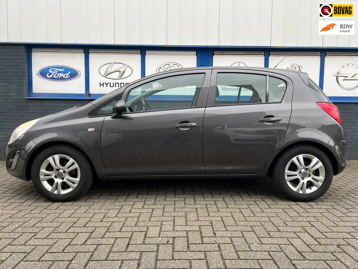 Opel Corsa 1.2-16V 5drs.airco Anniversary Edition 2012 3995eu Grijs - 1