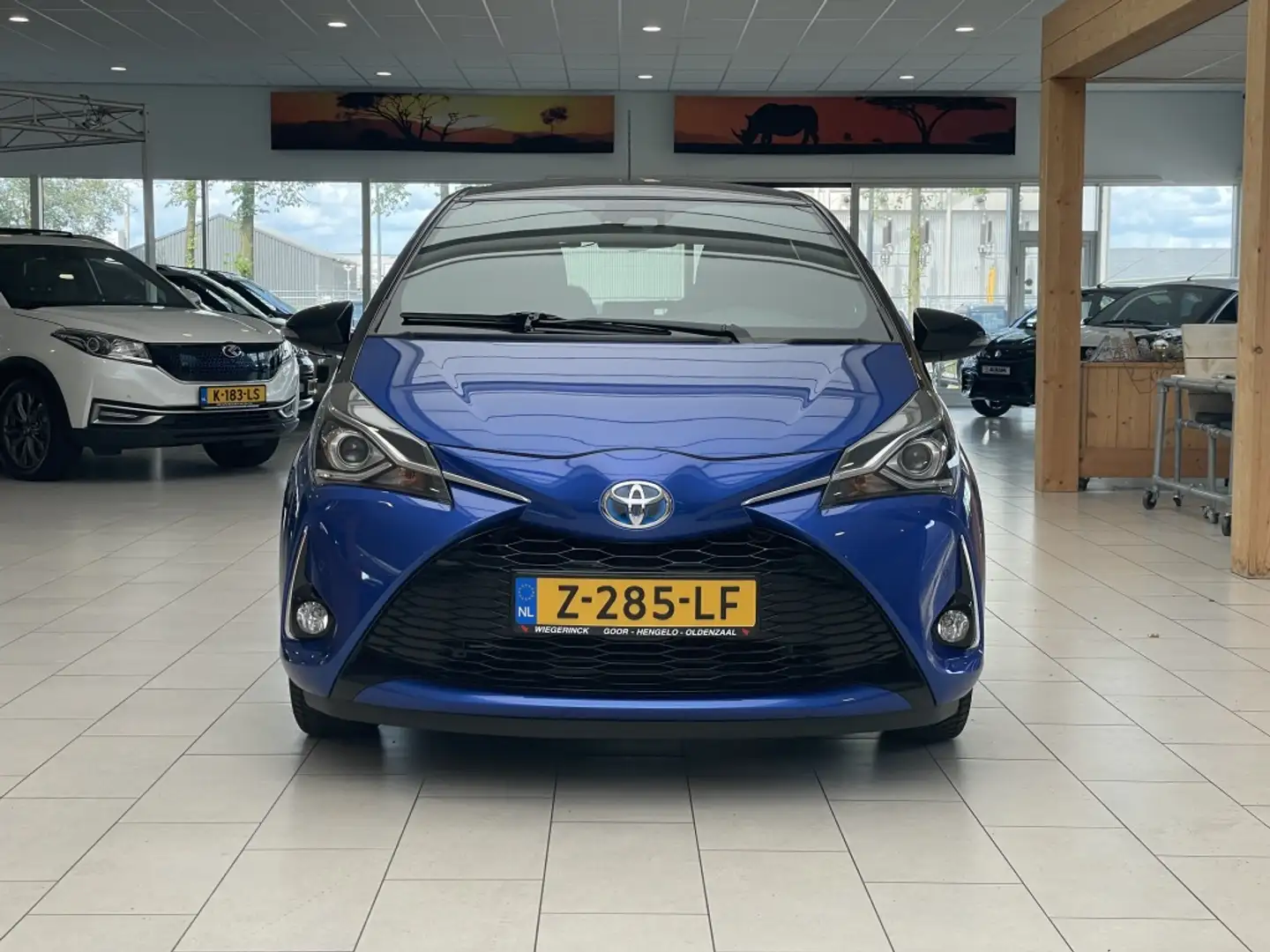 Toyota Yaris 1.5 Hybride Bi-Tone Plus [CLIMA I CRUISE I NAVIGAT Blauw - 2
