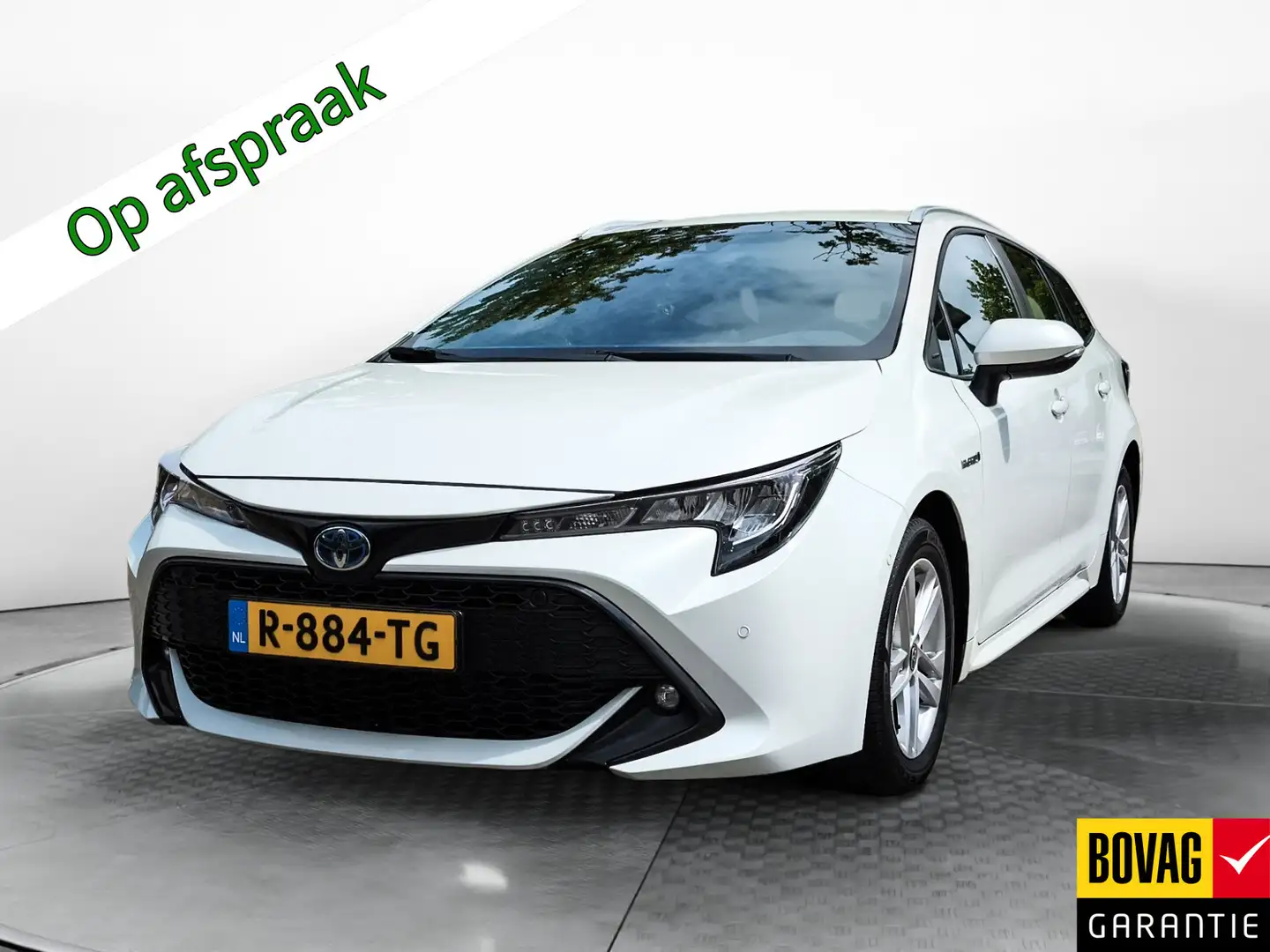 Toyota Corolla Touring Sports 1.8 Hybrid Business (98 PK) 2e-Eig. Wit - 1