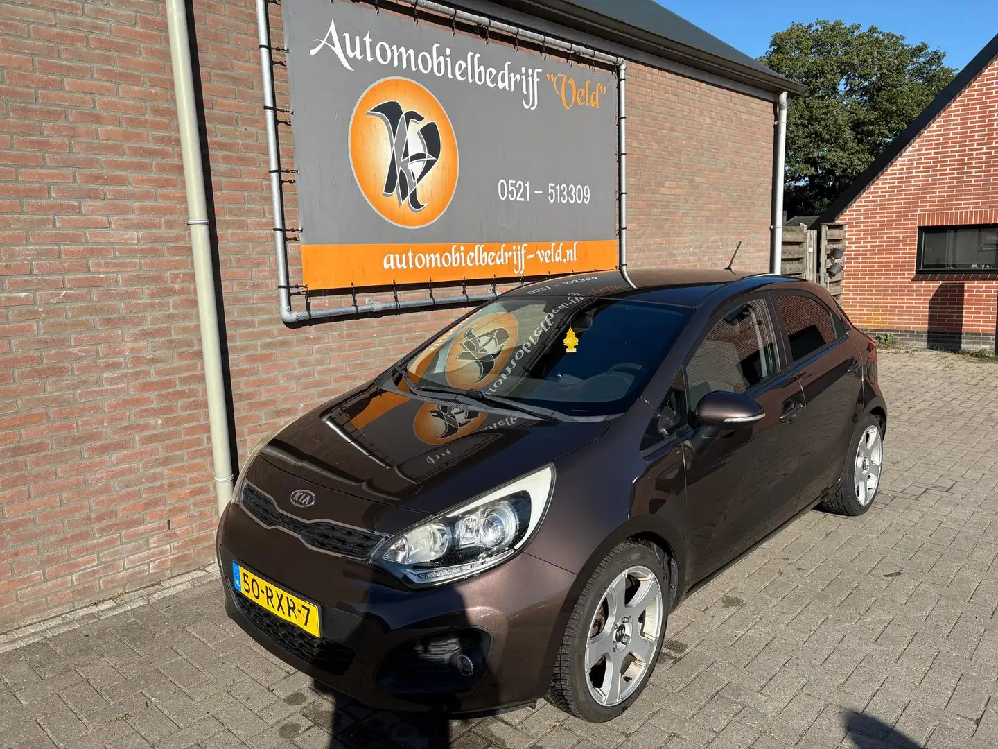 Kia Rio 1.2 CVVT Plus Pack Bruin - 1