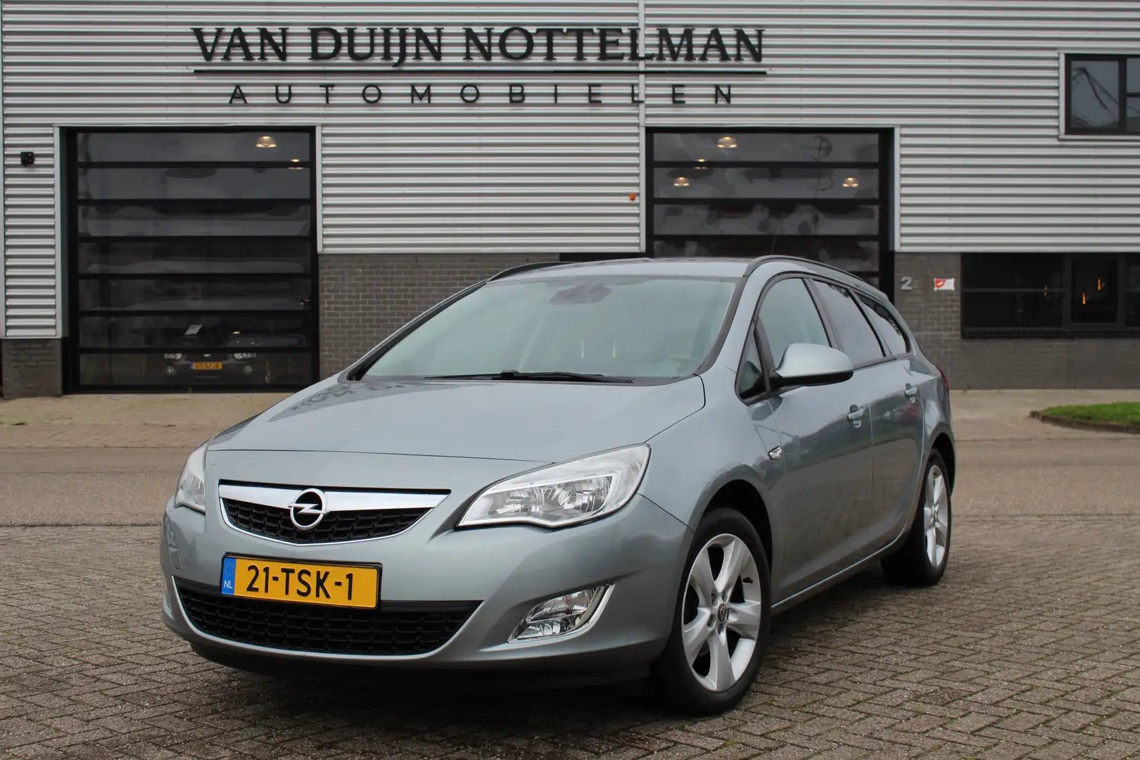 Opel Astra Sports Tourer 1.4 Turbo Edition / Airco / Cruise / Grey - 1