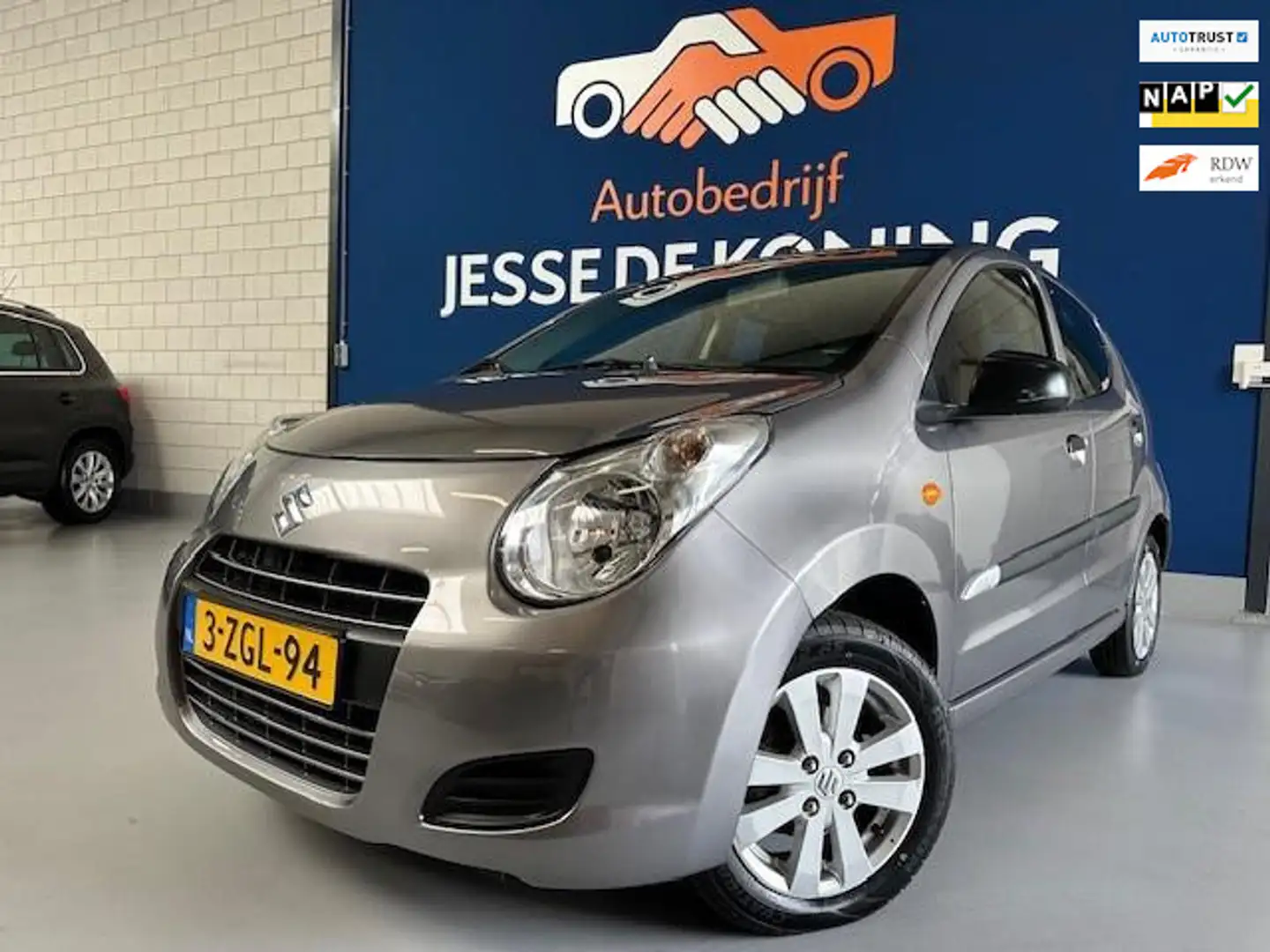 Suzuki Alto 1.0 Celebration EASSS,bj.2015,airco,NAP met 113.66 Grijs - 1