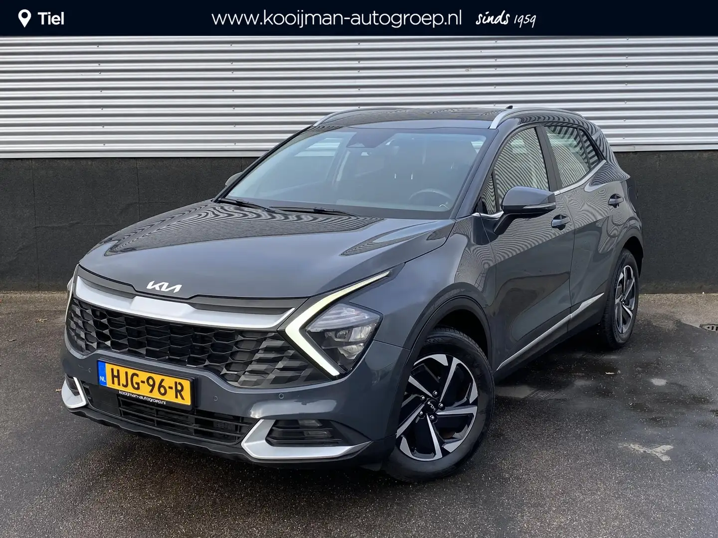 Kia Sportage 1.6 T-GDi Hybrid DynamicLine Navigatie, Parkeersen Grijs - 1