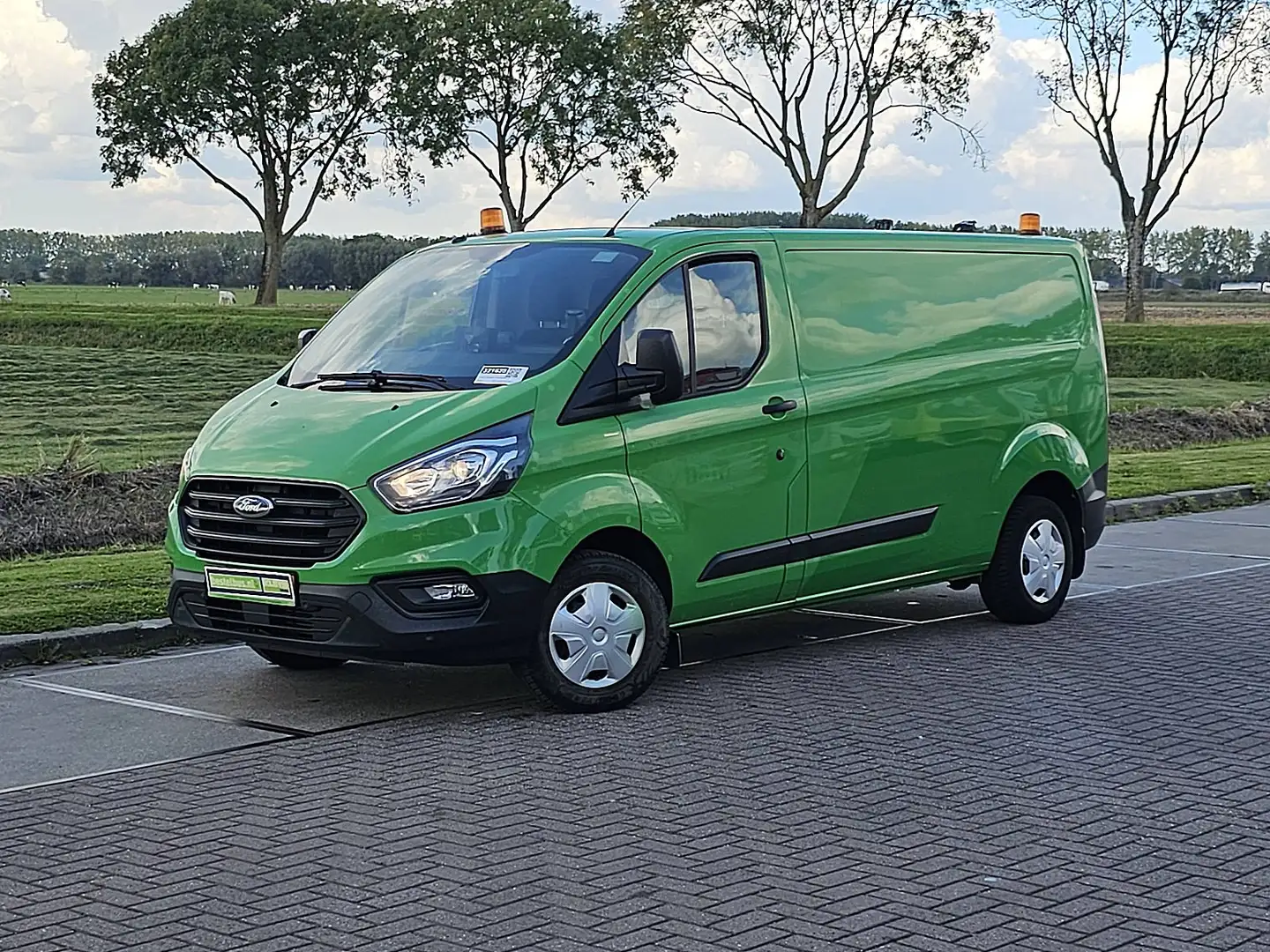 Ford Transit Custom 300 2.0 TDCI L2H1 Trend Navi Trekhaak Airco Camera Verde - 1