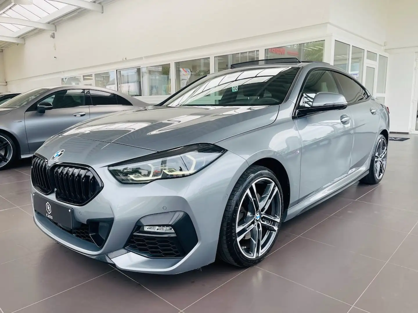BMW 218 iA ** GARANTIE + PACK M + TOIT PANO + LED + GPS ** Gris - 1