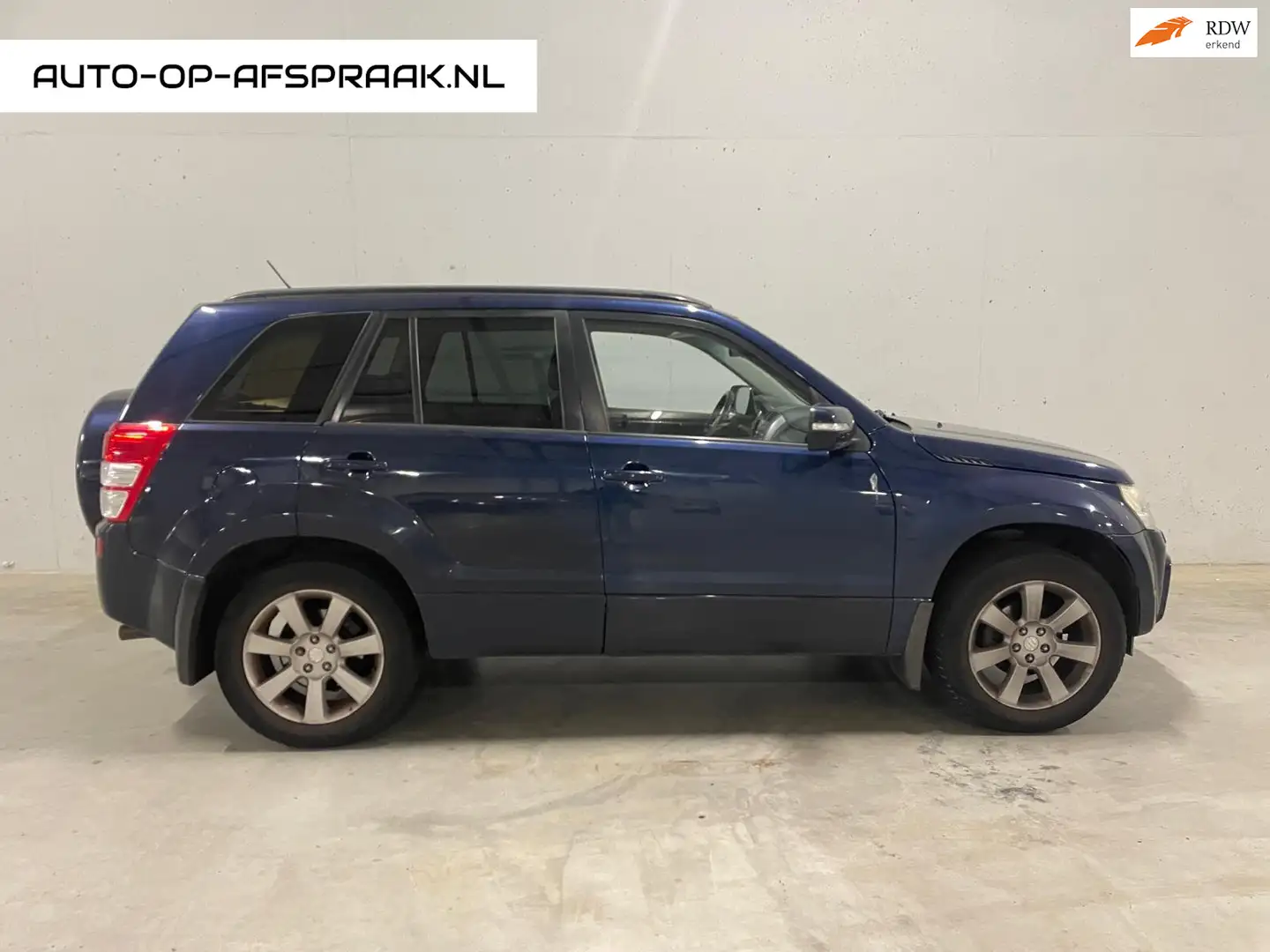 Suzuki Grand Vitara 2.4 High Executive 4x4 Leer Pano Blauw - 1