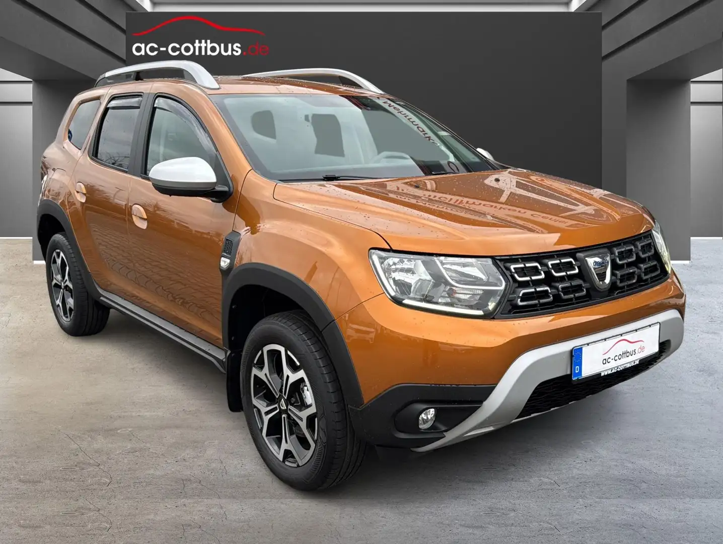 Dacia Duster II 1.3TCe Prestige Navi Klimaau Shzg Temp Orange - 1