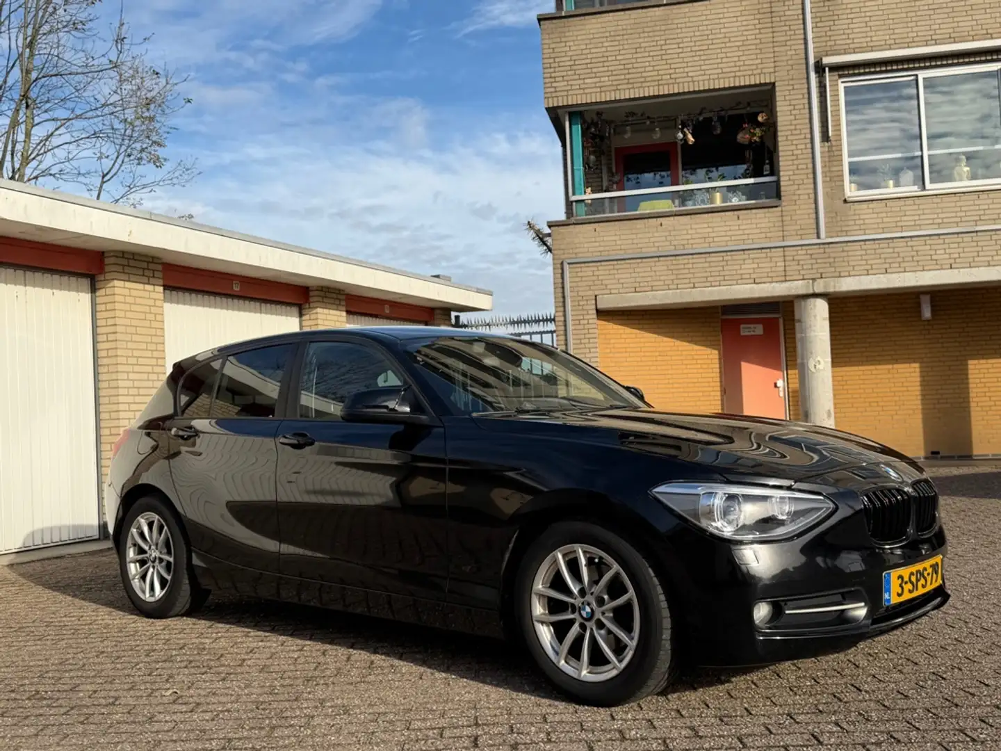BMW 114 1-serie 114i EDE Executive Zwart - 1