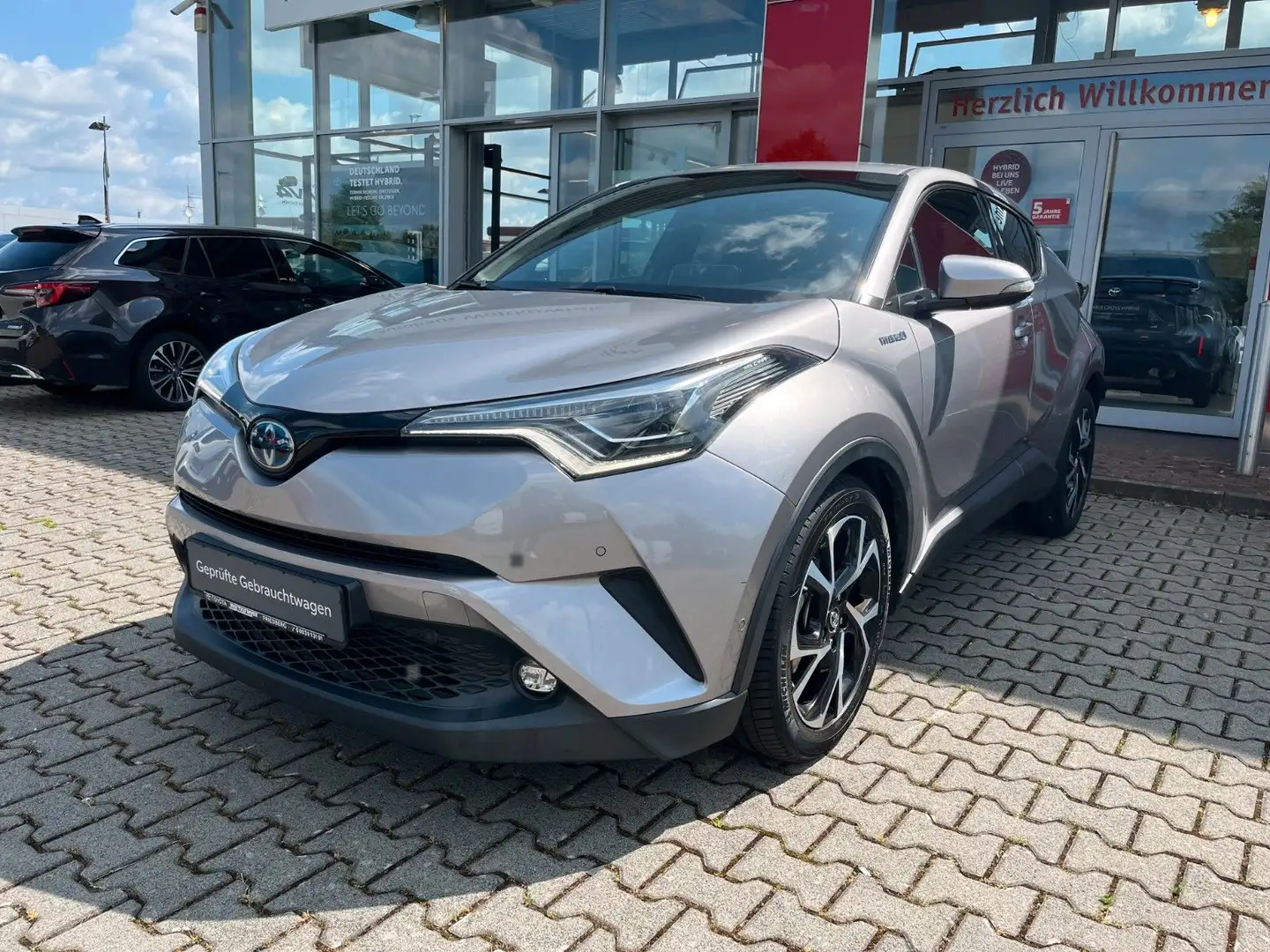 Toyota C-HR Hybrid Team D*LED*Navi*KeyFree*PDCv+h*Sitzh Grau - 1