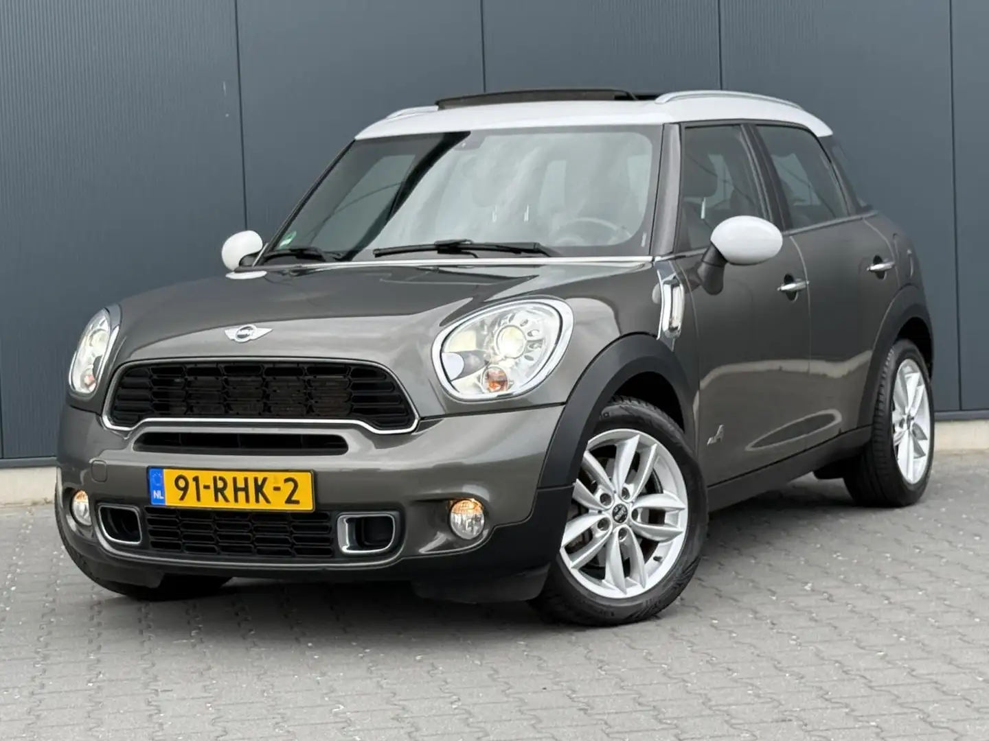 MINI Cooper S Countryman 1.6 ALL4 Pano - Xenon - Navi - Leder Grijs - 1