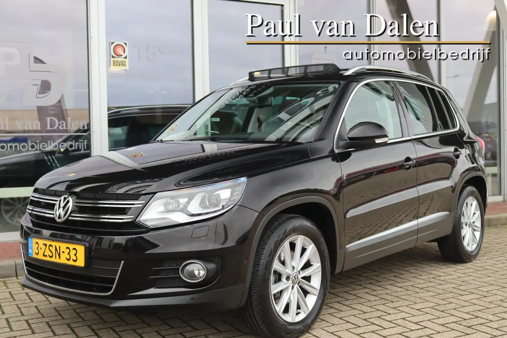 Volkswagen Tiguan 1.4TSI 160PK Sport&Style AUTOMAAT 1e Eigenaar | Pa Zwart - 1