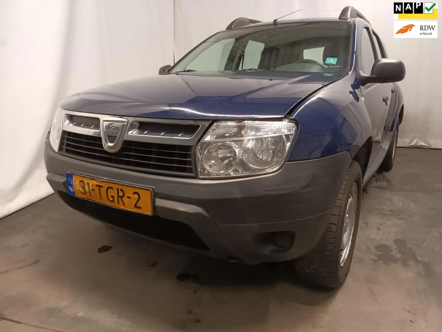 Dacia Duster 1.6 Ambiance 2wd - Uitlaat Defect - Schade Blauw - 1