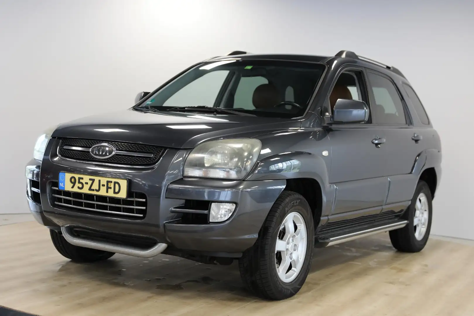 Kia Sportage 2.0 CVVT X-ception | Leer | Cruise | Stoelverwarmi Grijs - 1