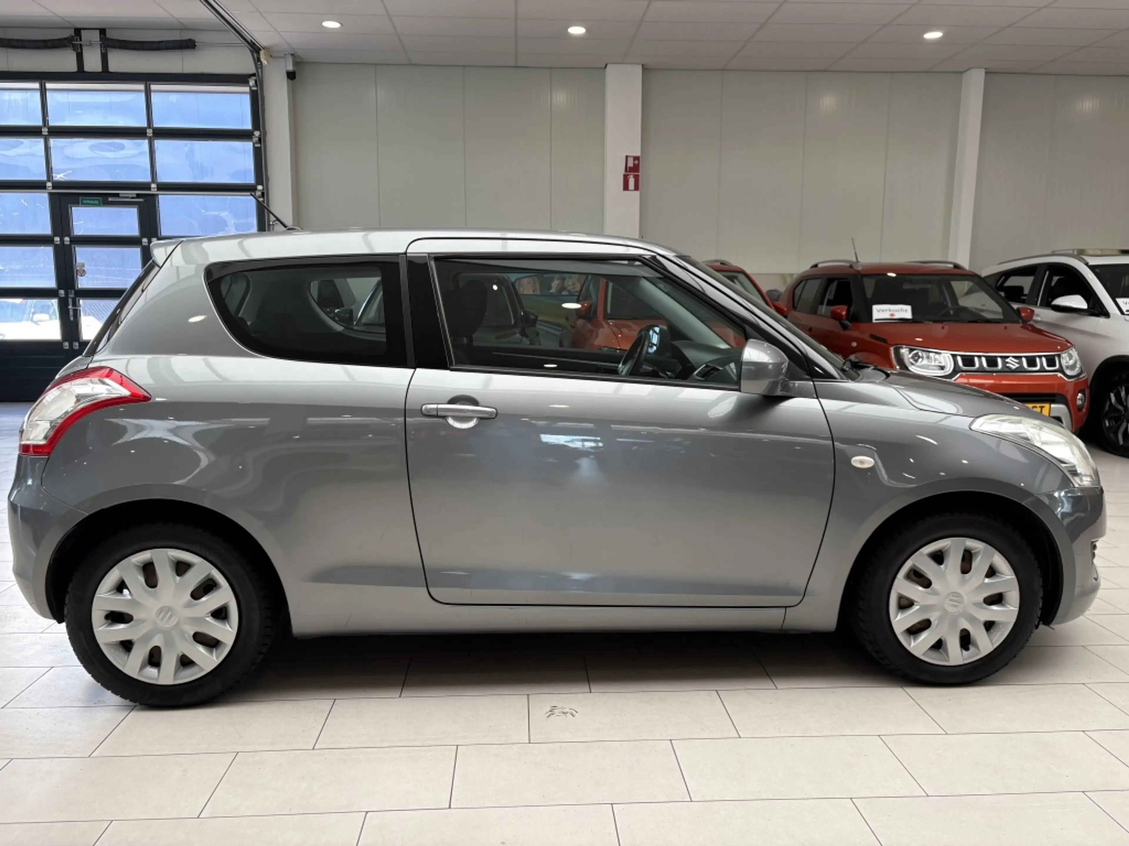 Suzuki Swift 1.2 Comfort [ TREKHAAK I ALL SEASON I STOELVERWARM — photo 9