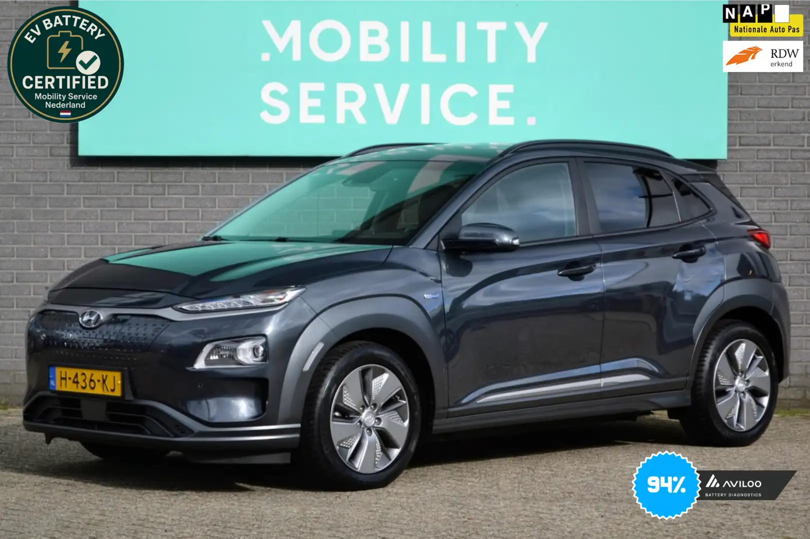 Hyundai KONA EV Premium 64 kWh SOH 94% 3FASE Clima ACC CarPlay Grijs - 1