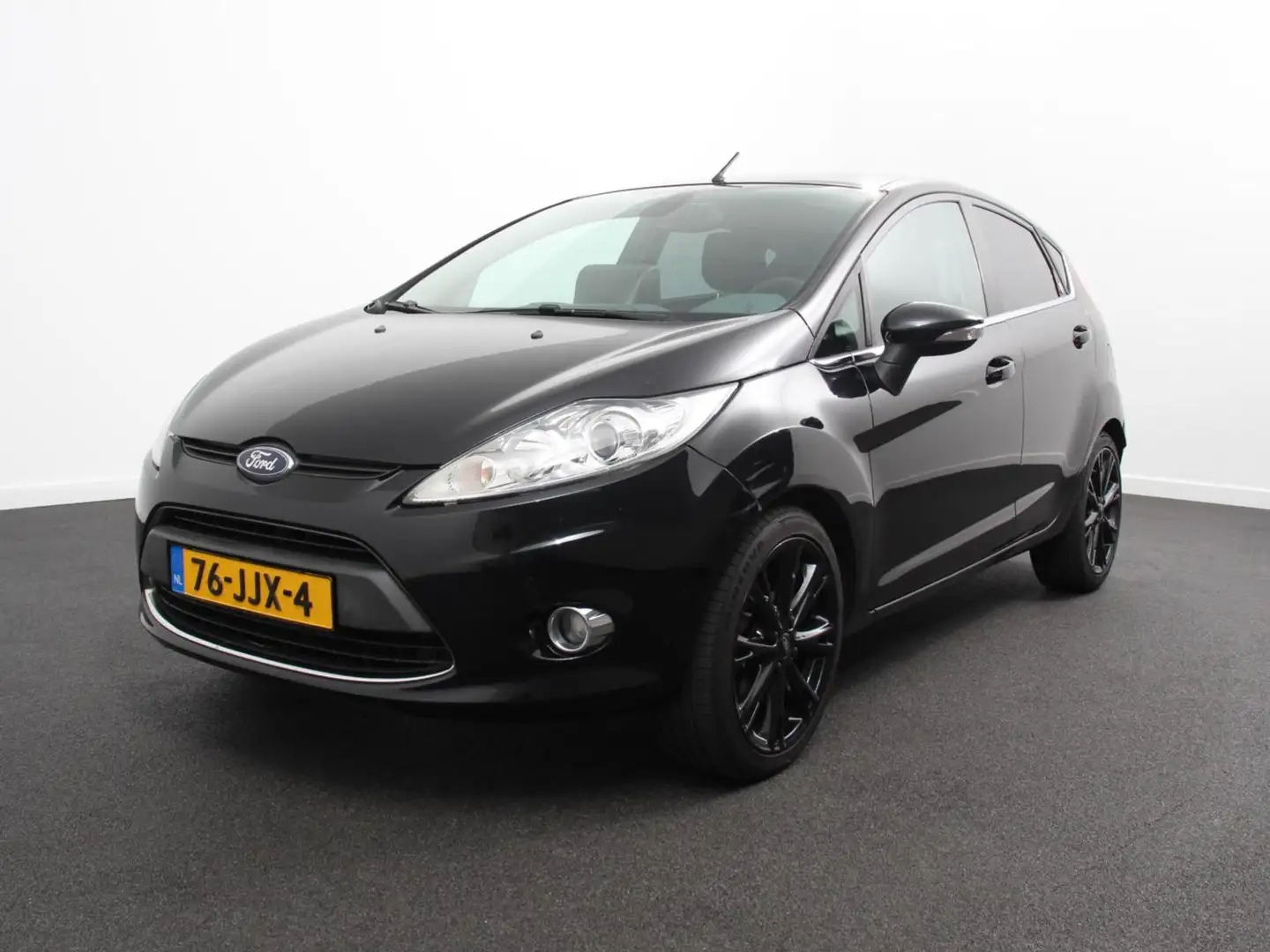 Ford Fiesta 1.25 Ghia Airco Cruise control Radio Lichtmetalen Zwart - 1