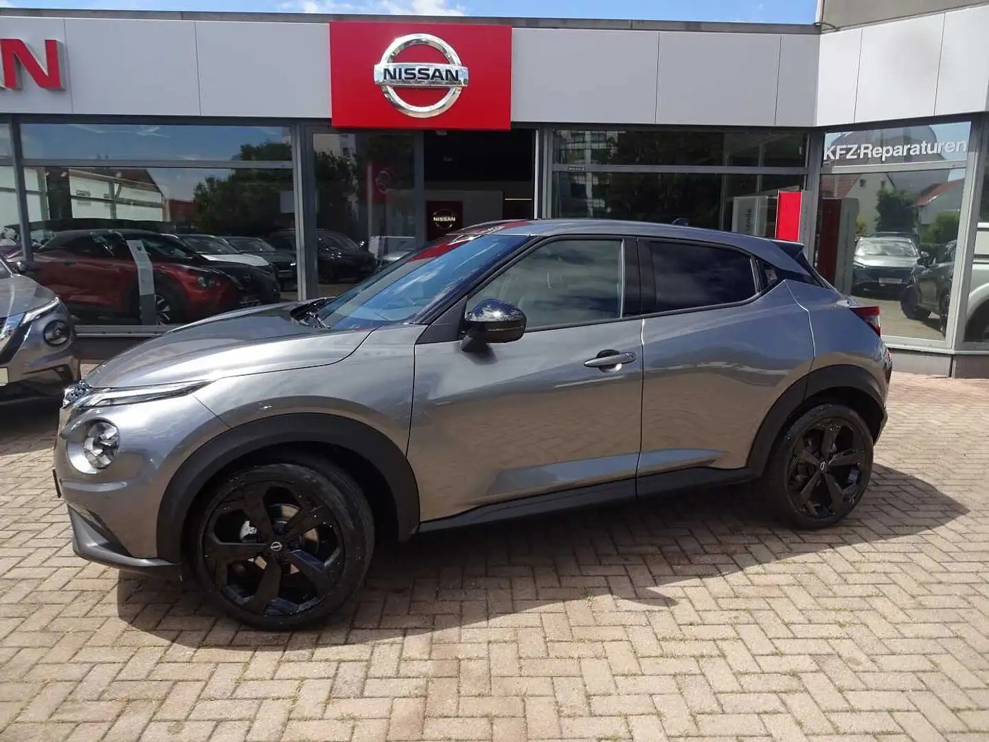 Nissan Juke 1.0 DIG-T Tekna, Bose Soundsystem, beheizbare Fron Grau - 1