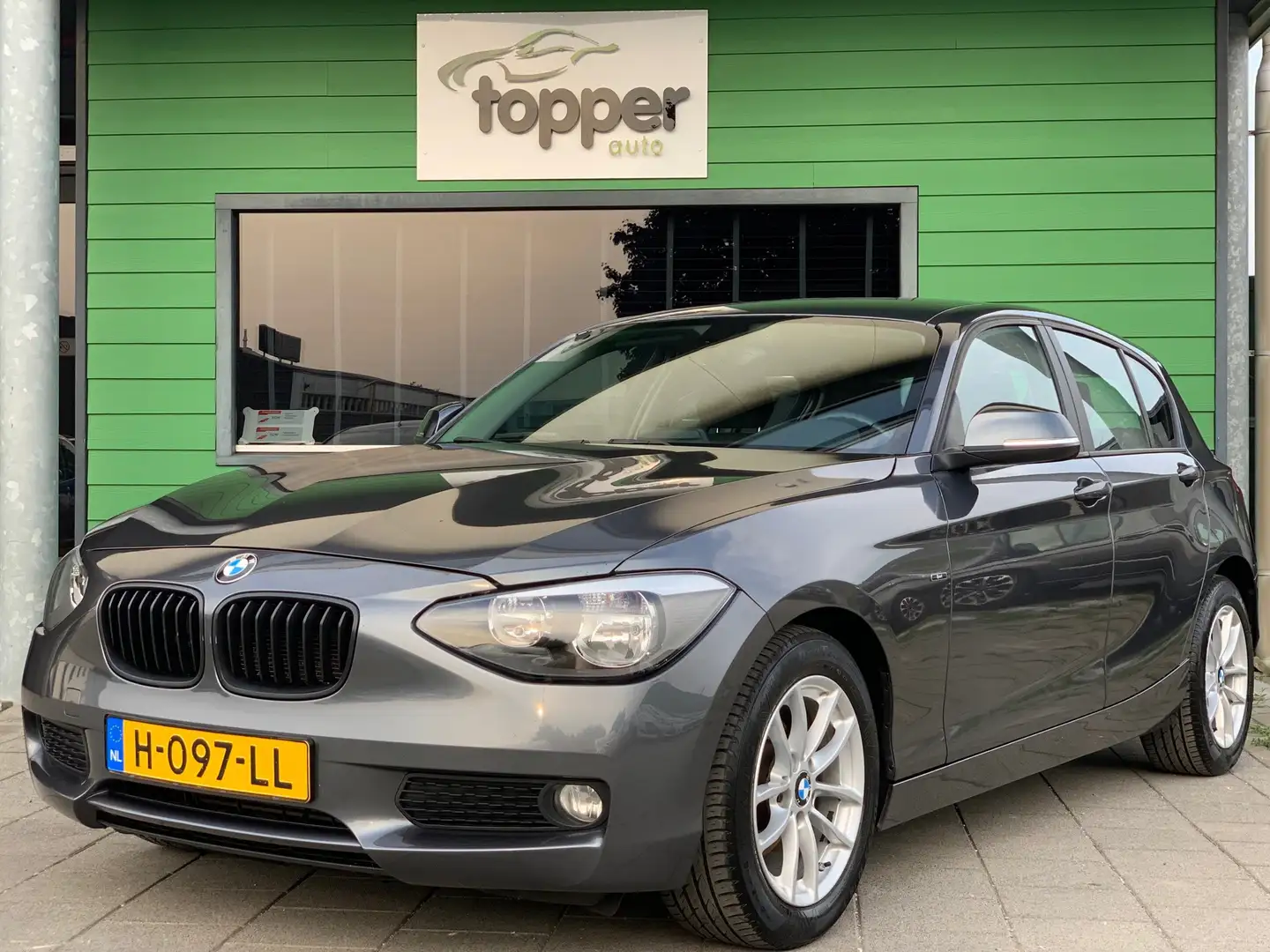 BMW 116 1-serie 116i High Executive | Navigatie | CruiseCo Gris - 1