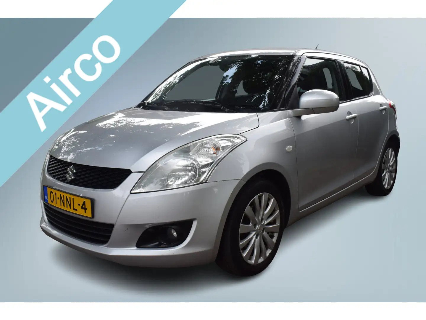Suzuki Swift 1.2 Exclusive EASSS Airco/Cruise/St.Verw. Zilver - 1