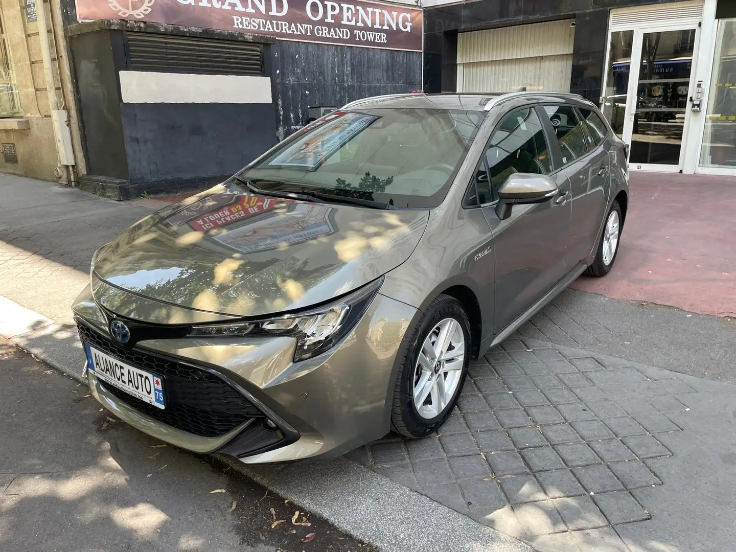 Toyota Corolla TS 1.8 HYBRID DYNAMIC E-CVT Business Brons - 1