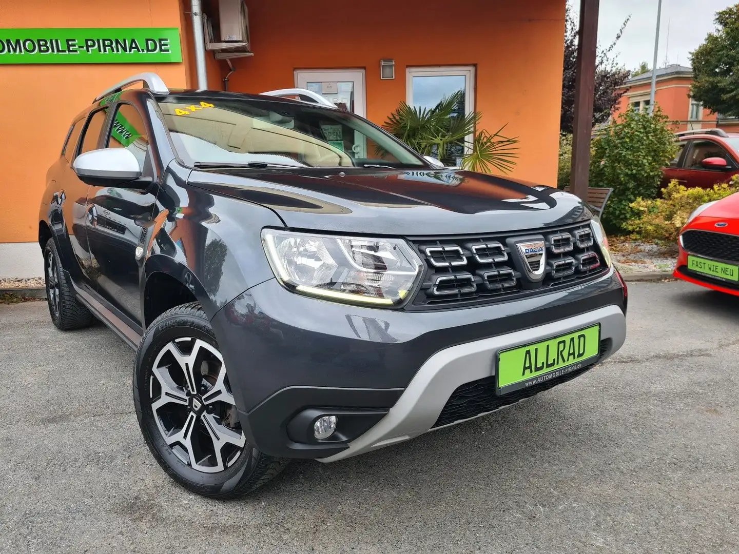 Dacia Duster II Prestige 4WD TCe 125 ALLRAD/NAVI/CAM Grijs - 1