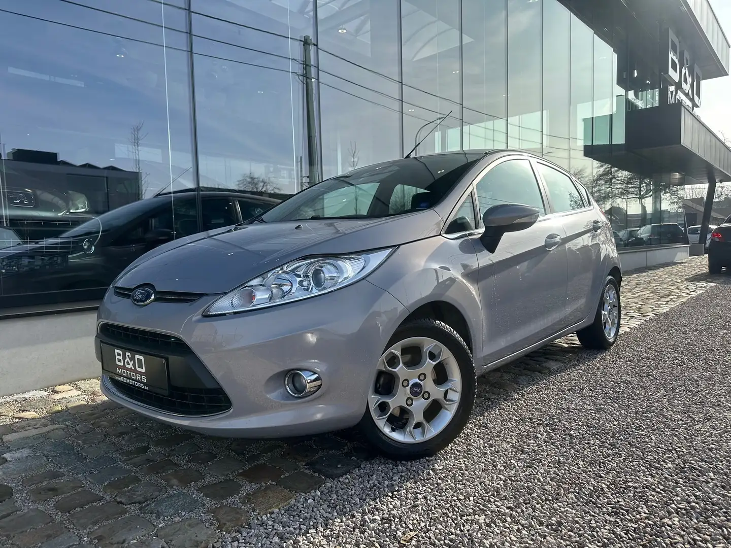 Ford Fiesta 1.4i Titanium 96 PS / 71 kW 5d Airco,Garantie Gris - 1