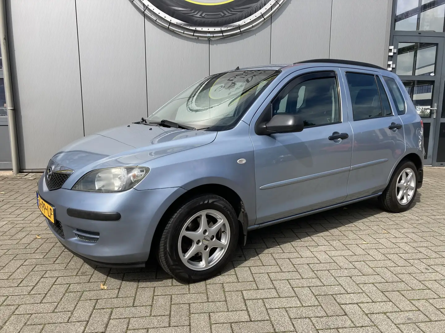 Mazda 2 1.4 Exclusive Trekhaak | IJskoude airco | rijdt en Azul - 1