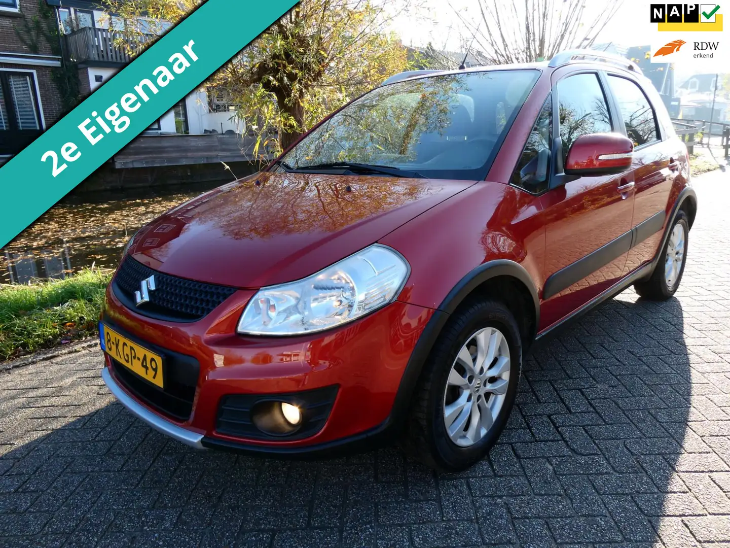 Suzuki SX4 1.6 4WD 120pk 2e eigenaar Clima Navi Trekhaak 1200 Oranje - 1