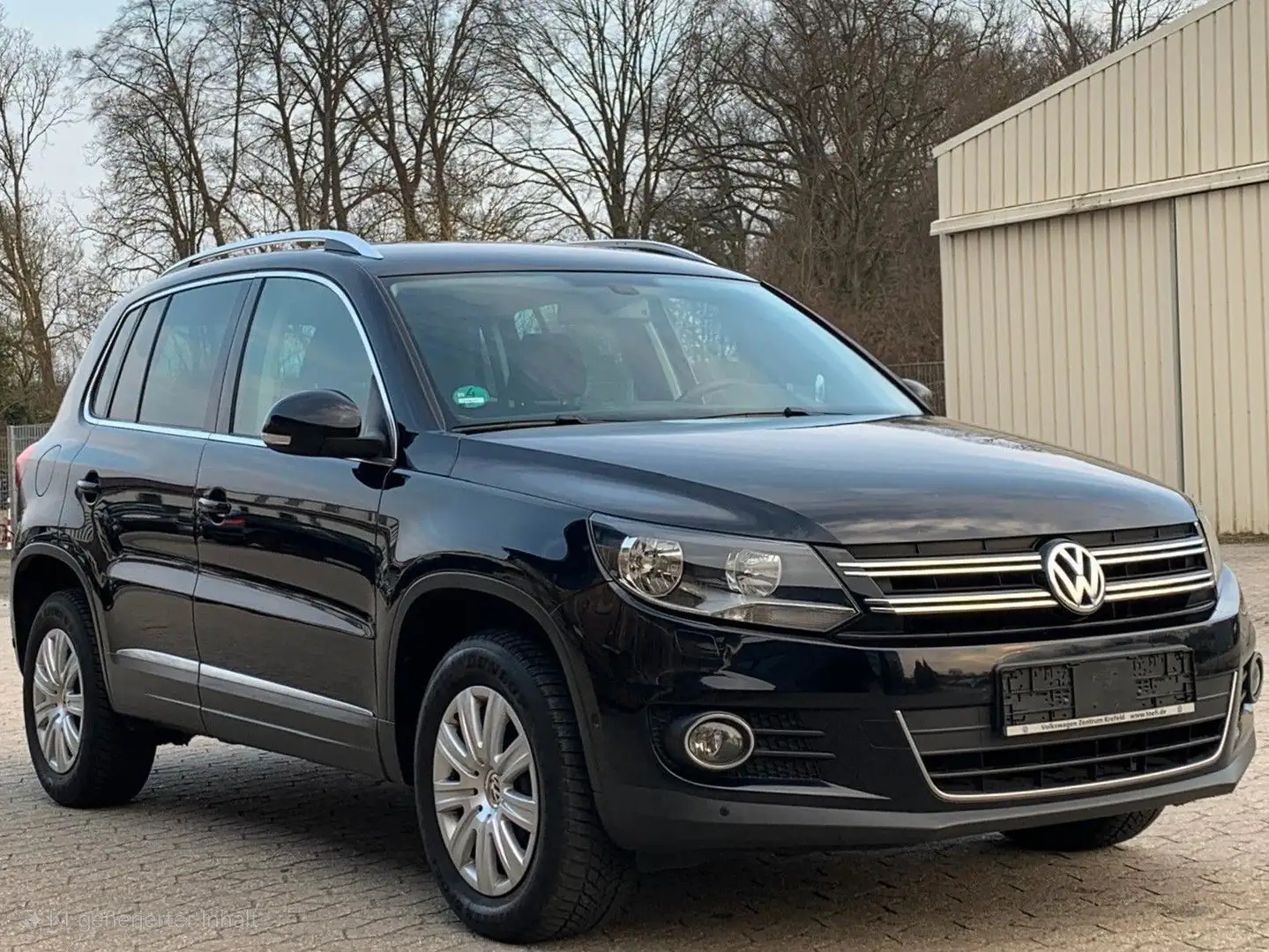 Volkswagen Tiguan Sport & Style|1.Hand|Allrad|Navi|AHK| Schwarz - 1