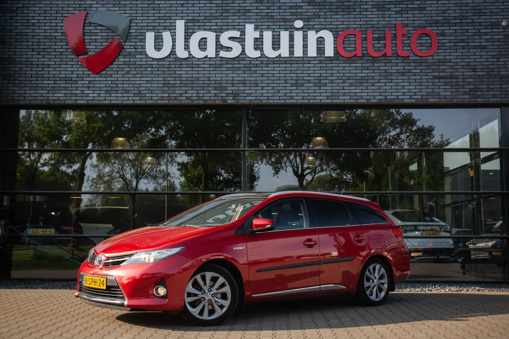 Toyota Auris Touring Sports 1.8 Hybrid Lease Panoramadak, Cruis Rood - 1