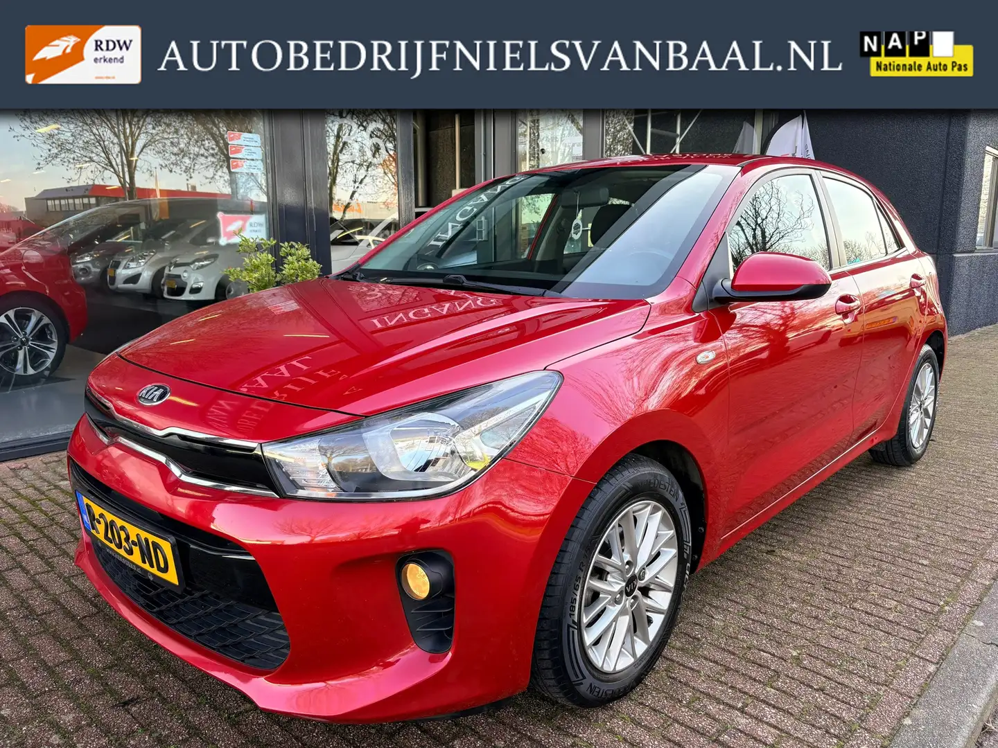 Kia Rio 1.4 DynamicLine 65Dkm/Navi/Airco/Cruise/PDC/LM-Vel Rouge - 1