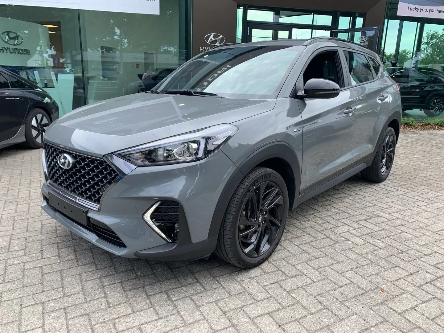 Hyundai TUCSON T-GDi Feel N-LINE DCT **NIEUWSTAAT + GARANTIE** Gris - 1