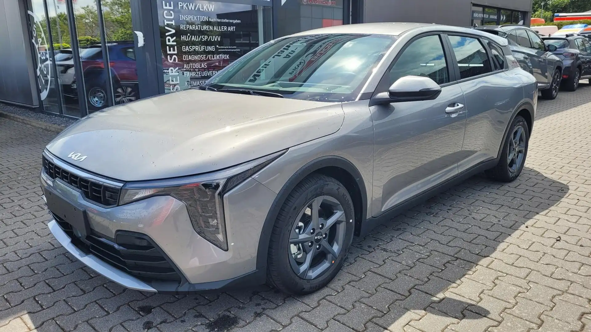 Kia K4 Vision 1.0 +NAVI+SHZ+ACA+LED+KAMERA 85 kW (116 ... Grau - 1