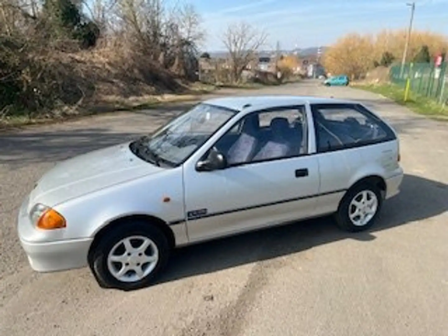 Suzuki Swift 1.0i GLS X-tra limited édition Silber - 1