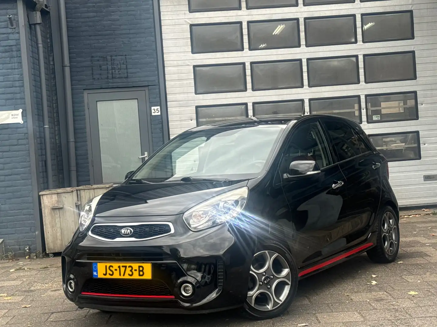 Kia Picanto 1.2 CVVT SportsLine Navigator | Clima | Camera | C Noir - 1