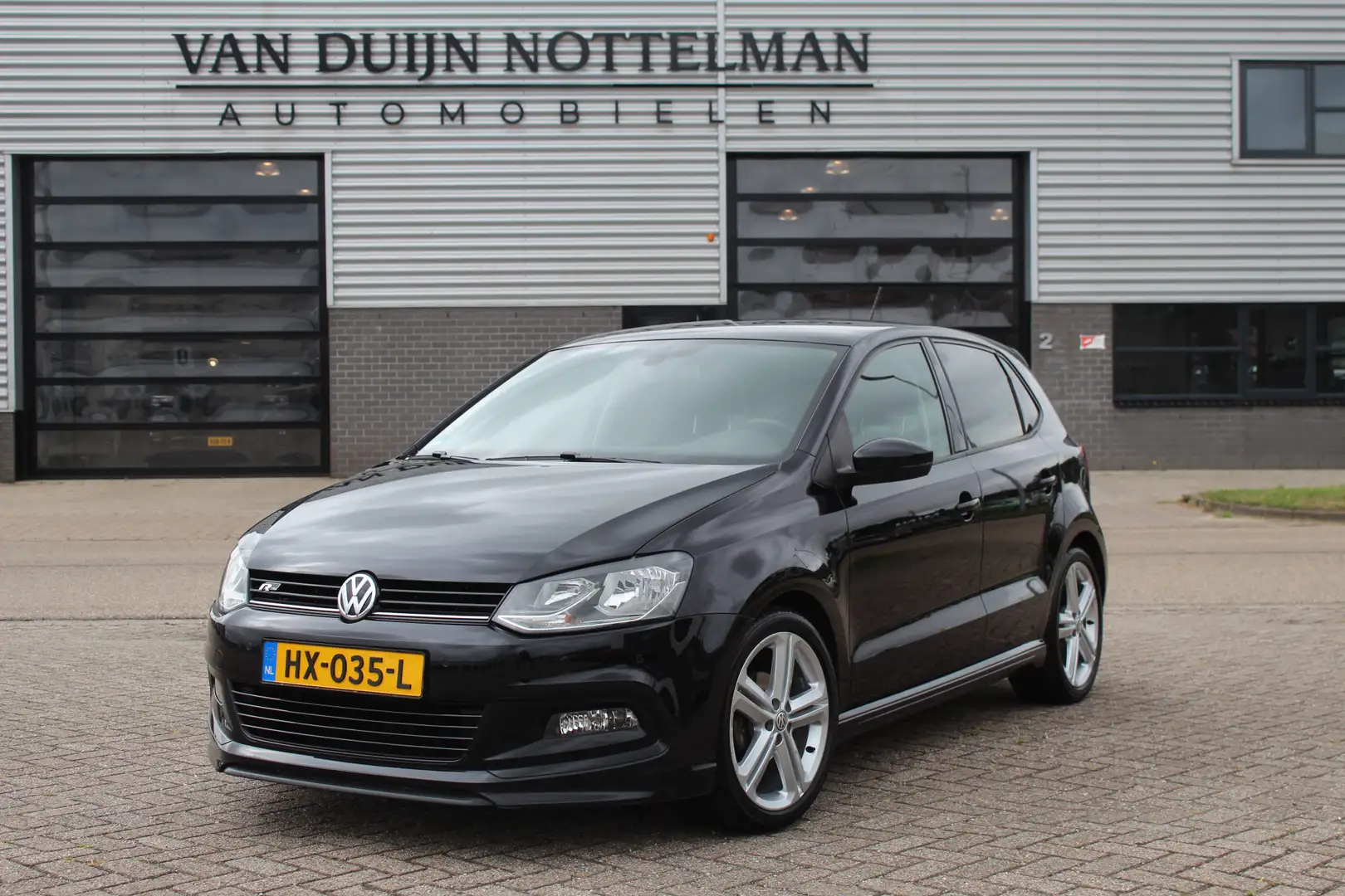 Volkswagen Polo 1.2 TSI Edition R / Navigatie / Clima / N.A.P. Zwart - 1