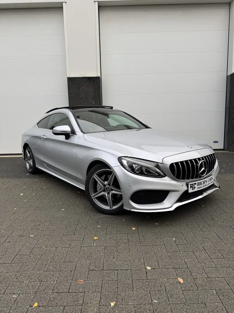 Mercedes-Benz C 180 C 180 Coupe AMG LINE PANO Zilver - 1