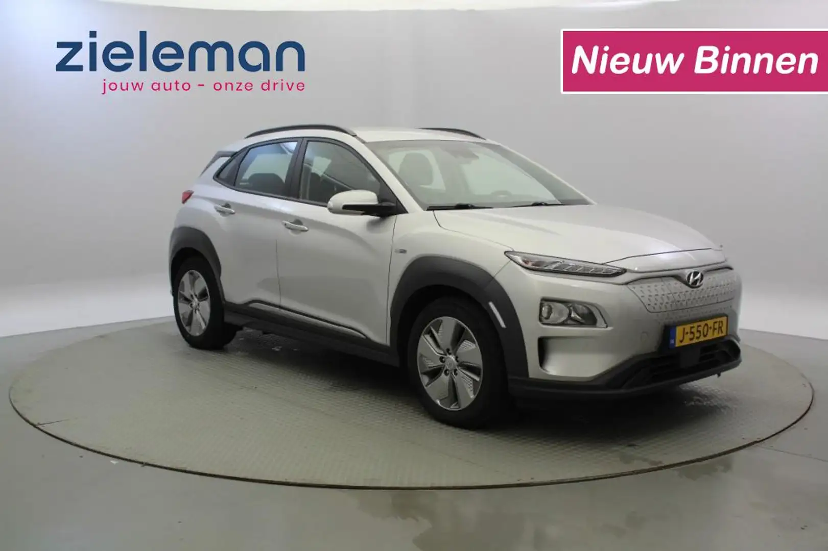 Hyundai KONA Comfort 64 kWh - Carplay, Camera, Cruise, Trekhaak Grijs - 1