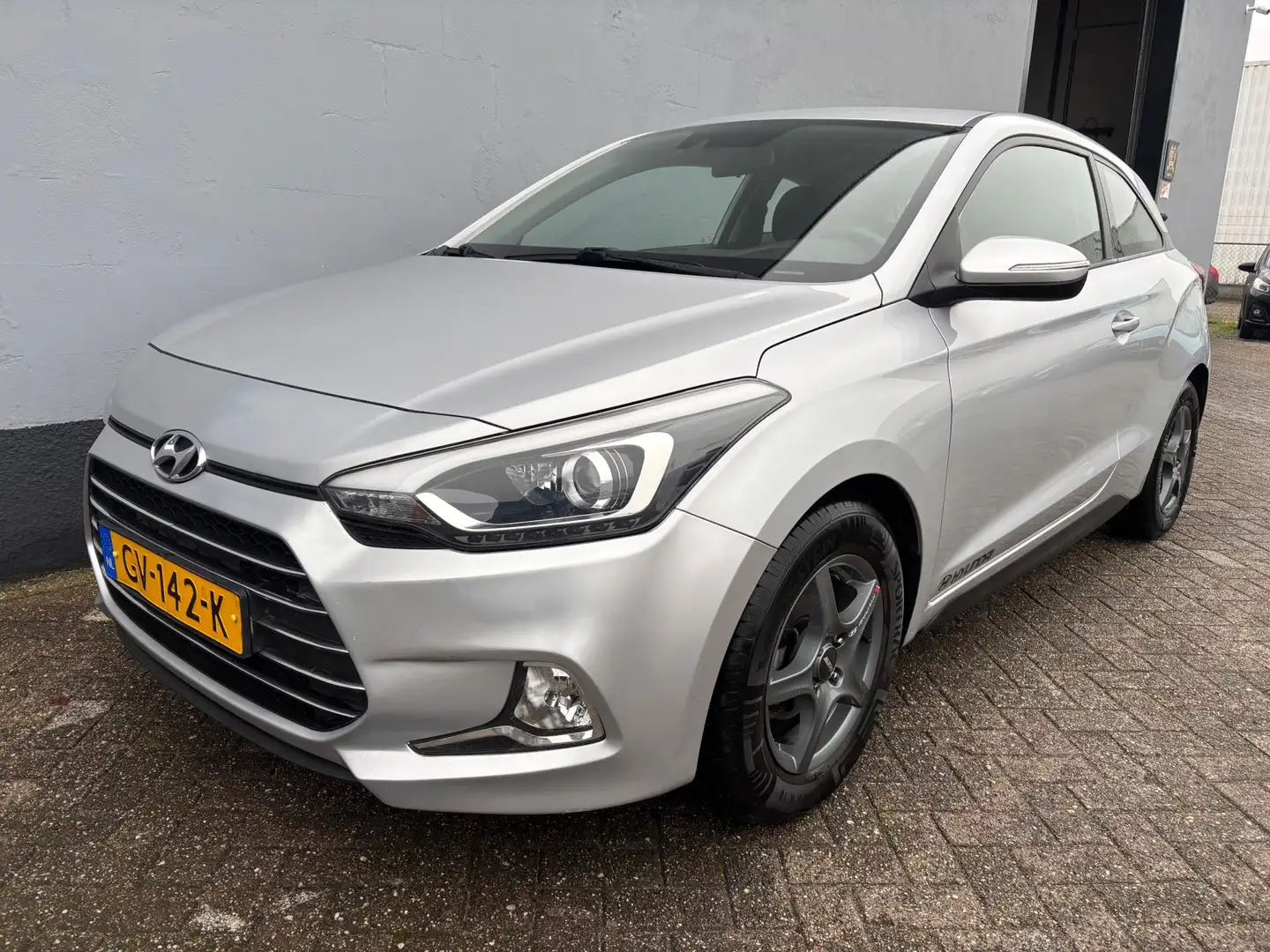 Hyundai i20 Coupé 1.2 HP i-Motion - Airco - LMV Grijs - 1