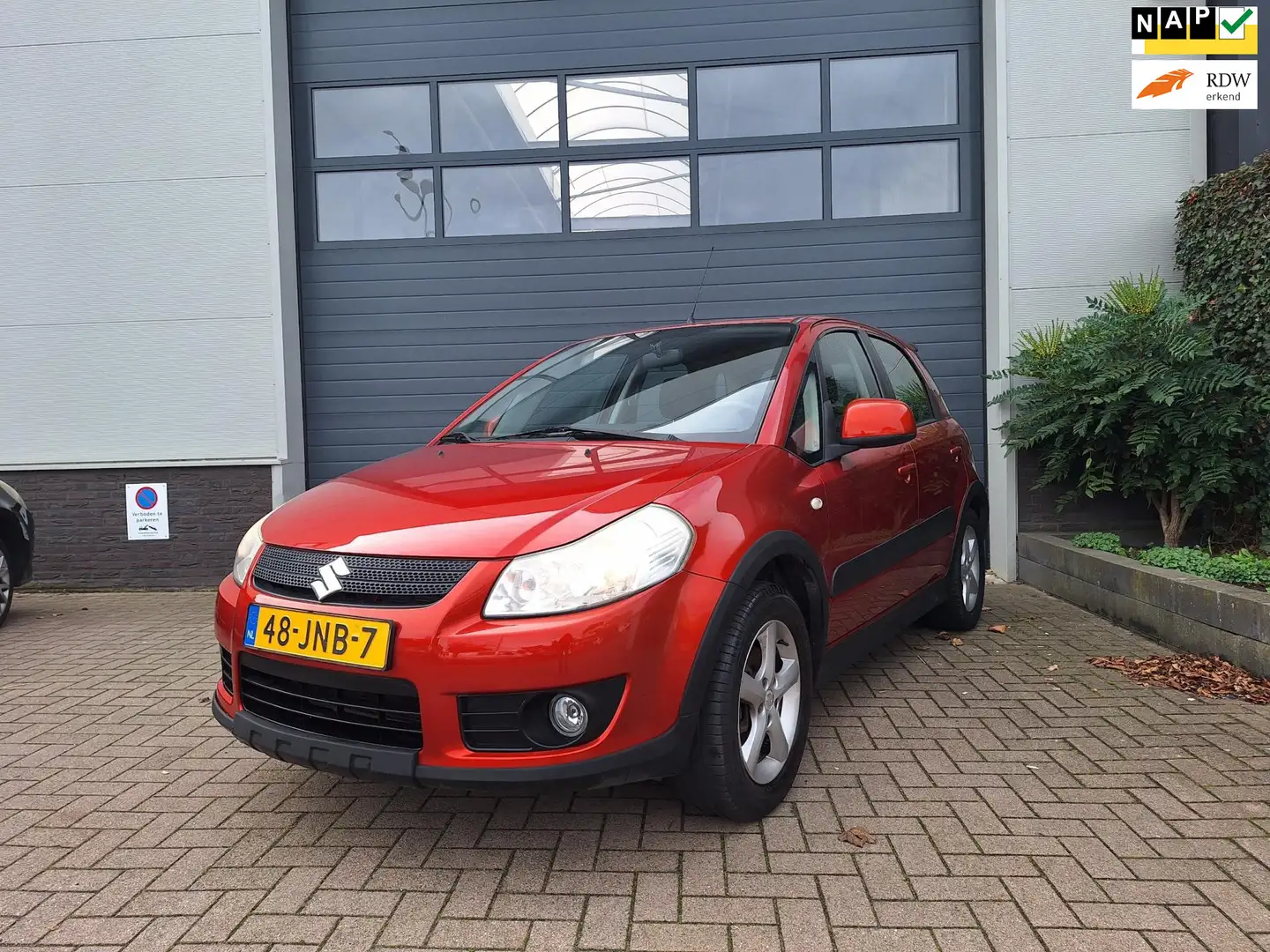 Suzuki SX4 | 1.6 Exclusive | Lage km stand | Airco | Keyless Oranje - 1