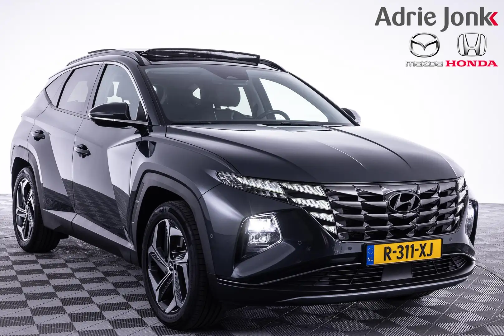Hyundai TUCSON 1.6 T-GDI HEV Premium Sky | AUTOMAAT | APPLE CARPL Grigio - 1