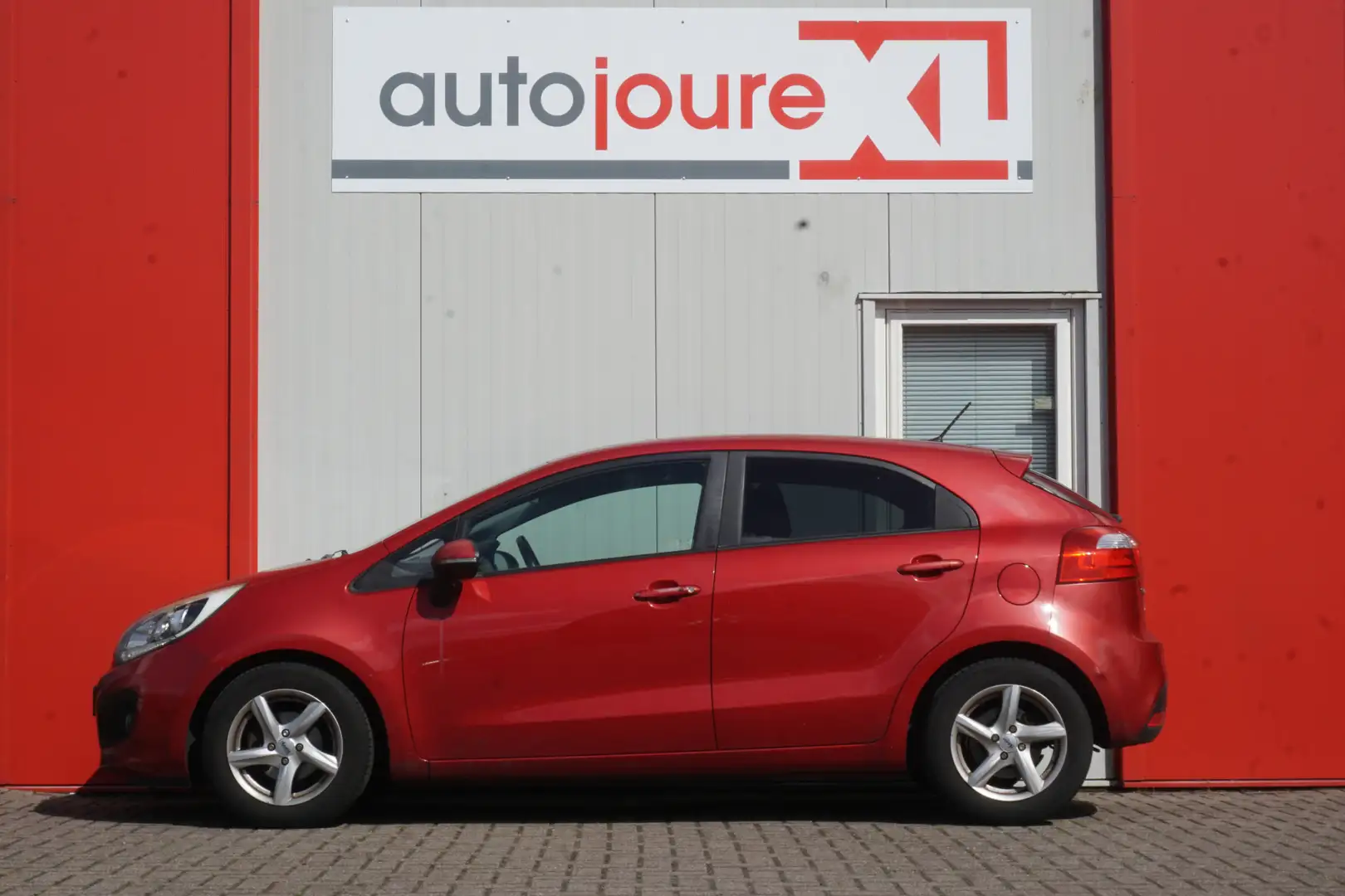 Kia Rio 1.2 CVVT Super Pack | Origineel NL | PDC | Airco | Rouge - 2