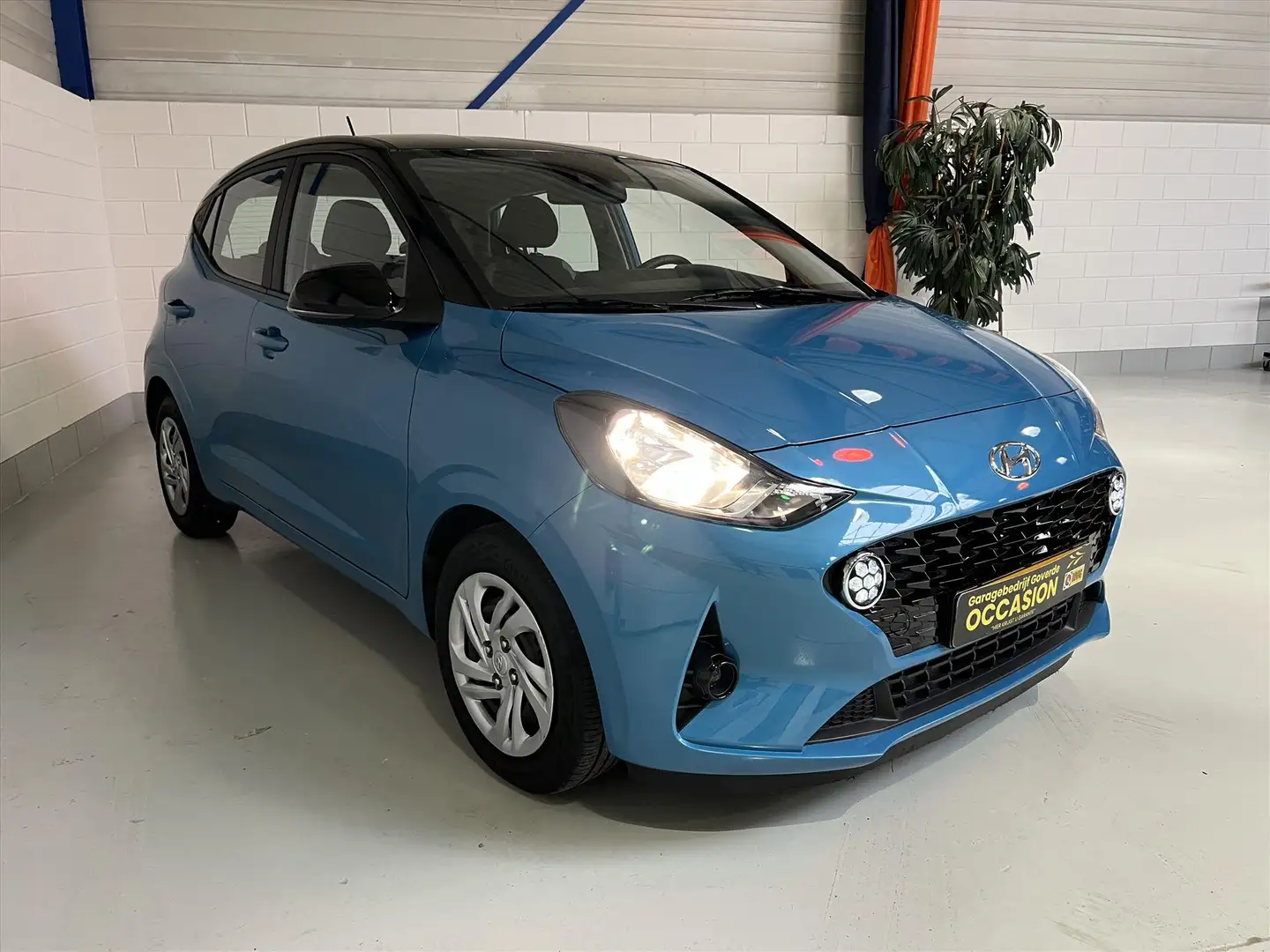 Hyundai i10 1.0i 67pk AUT. Camera, Cruise, Navi, Carplay Blauw - 1