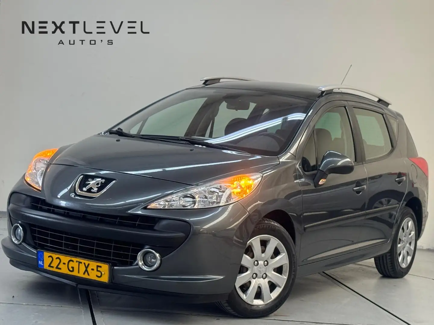 Peugeot 207 SW 1.6 VTi XS Automaat Airco Pano Apk Grijs - 1