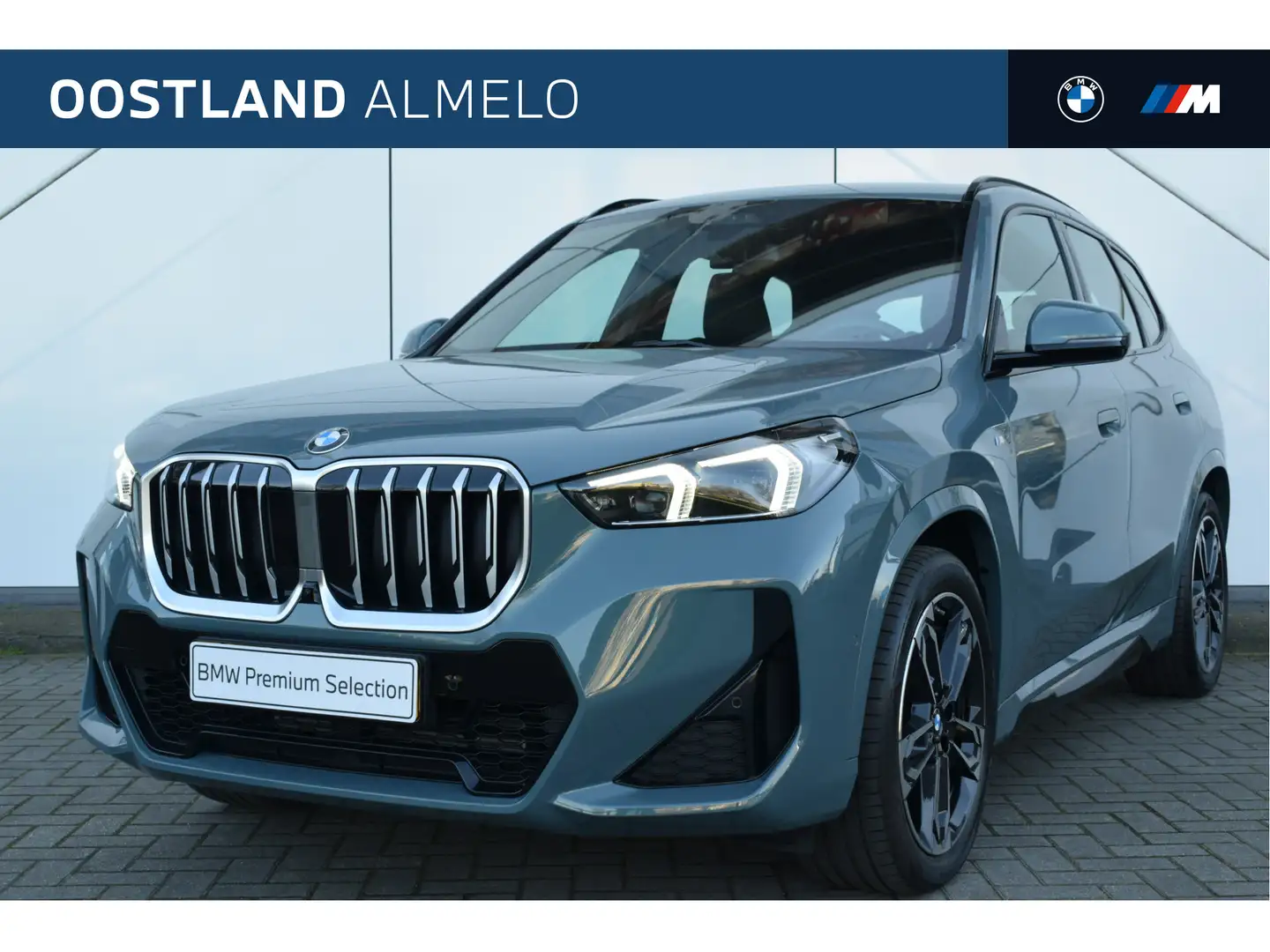 BMW X1 sDrive20i High Executive M Sport Automaat / Trekha Groen - 1
