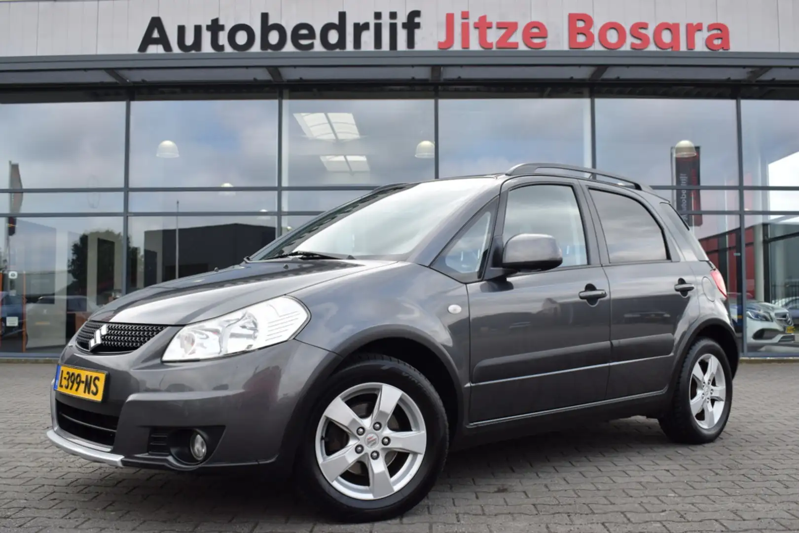 Suzuki SX4 1.6 Automaat Comfort ECC | Keyless | Stoelverwarmi Grigio - 1