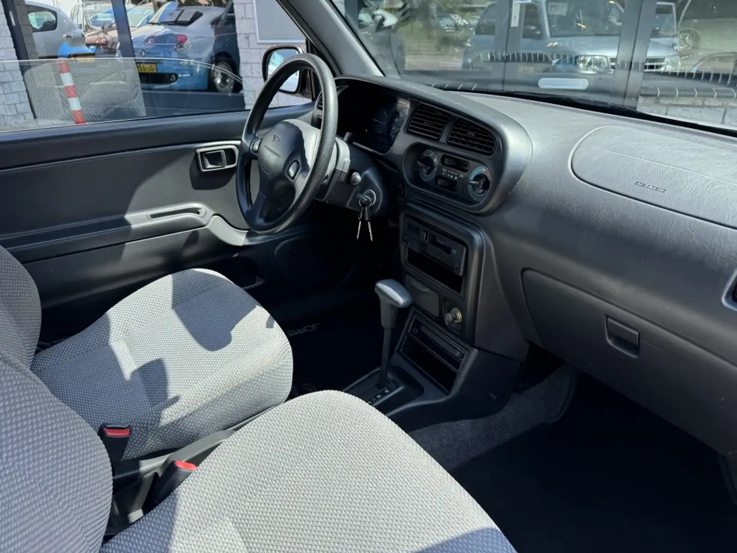Daihatsu Cuore 1.0-12V Nieuwe Apk Weinig km NAP AUTOMAAT Gris - 2